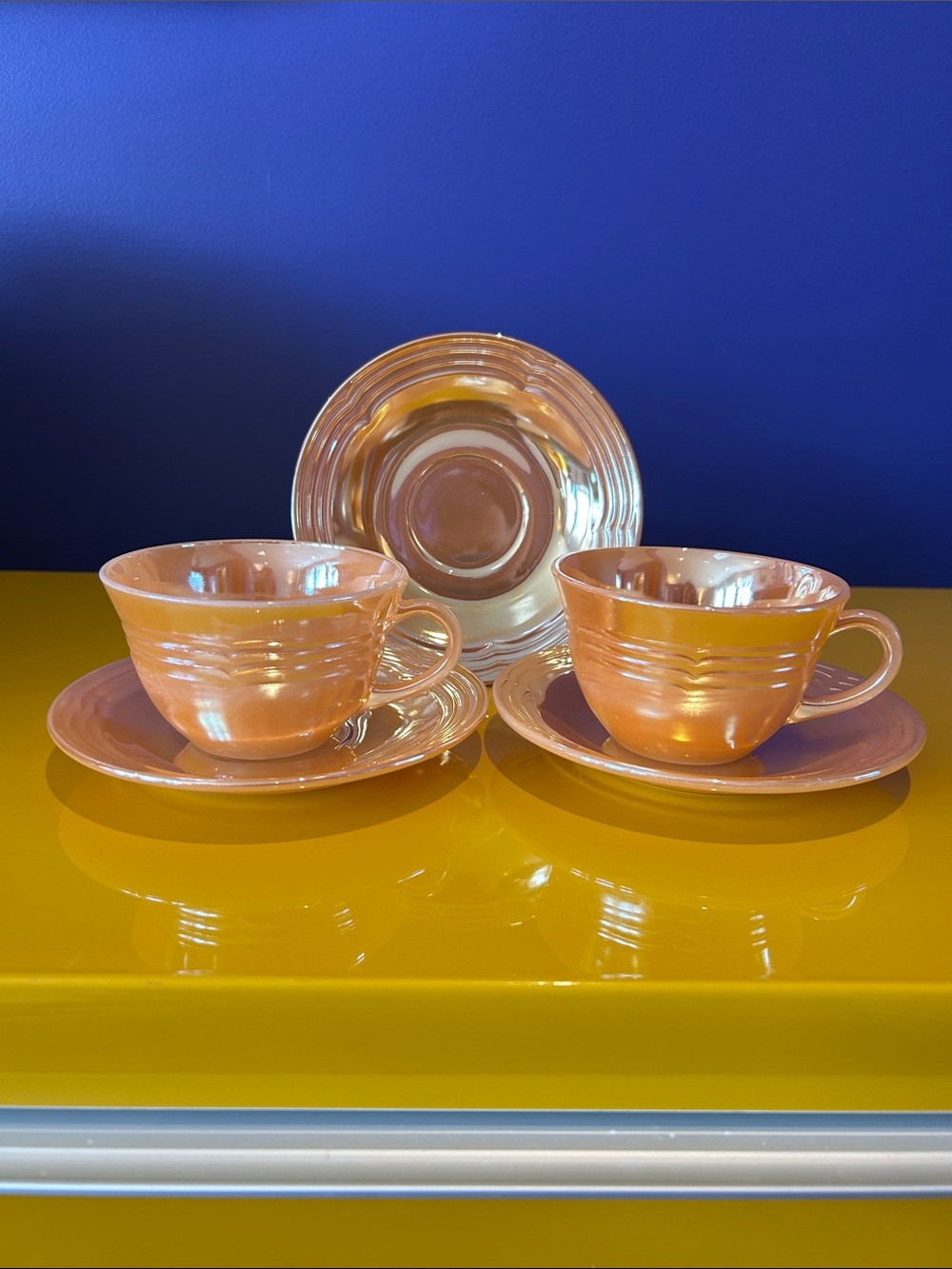 Fire King Peach Lustre cups and plates in Three-Band Pattern
